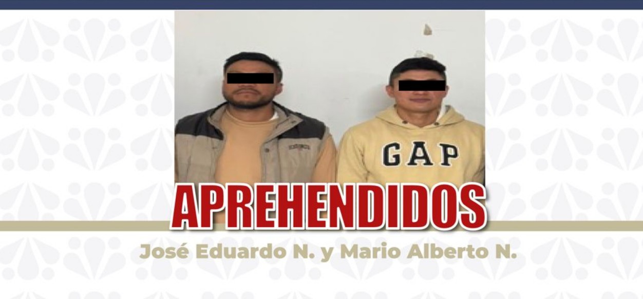 Agentes de la Fiscalía de Puebla durante un operativo de cumplimiento de orden de aprehensión.