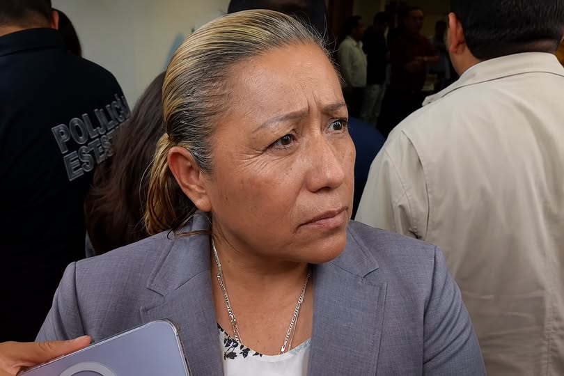 Fiscal de Tlaxcala durante una conferencia sobre trata de personas.