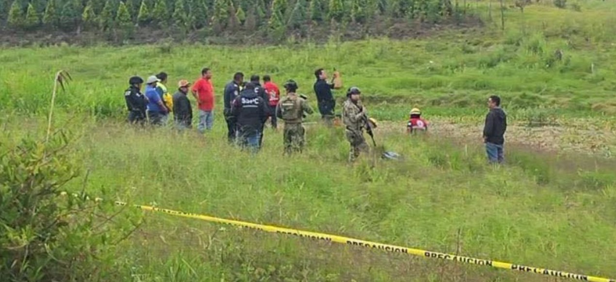 Autoridades realizan diligencias en la presa de Tenango tras el hallazgo de un cuerpo.
