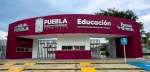 Foto: Cortesía Estudiantes caminando bajo la lluvia en Puebla.