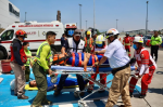 Personas evacuando Galerías Tlaxcala durante simulacro de sismo